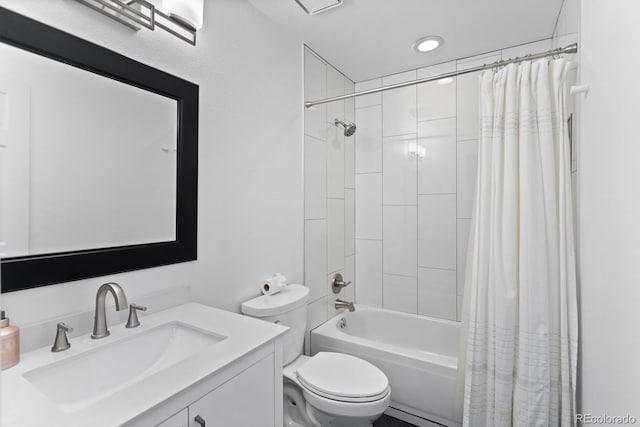 full bathroom with shower / tub combo, vanity, and toilet