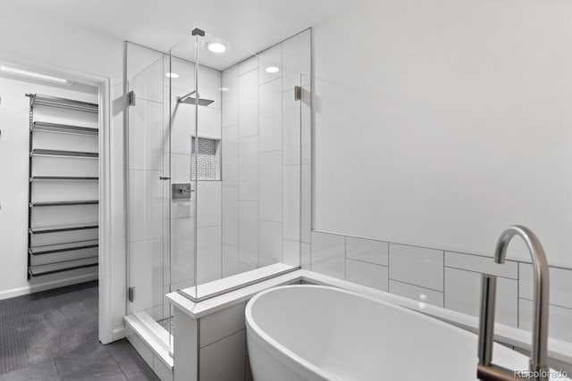 bathroom featuring tile patterned flooring, radiator, and separate shower and tub