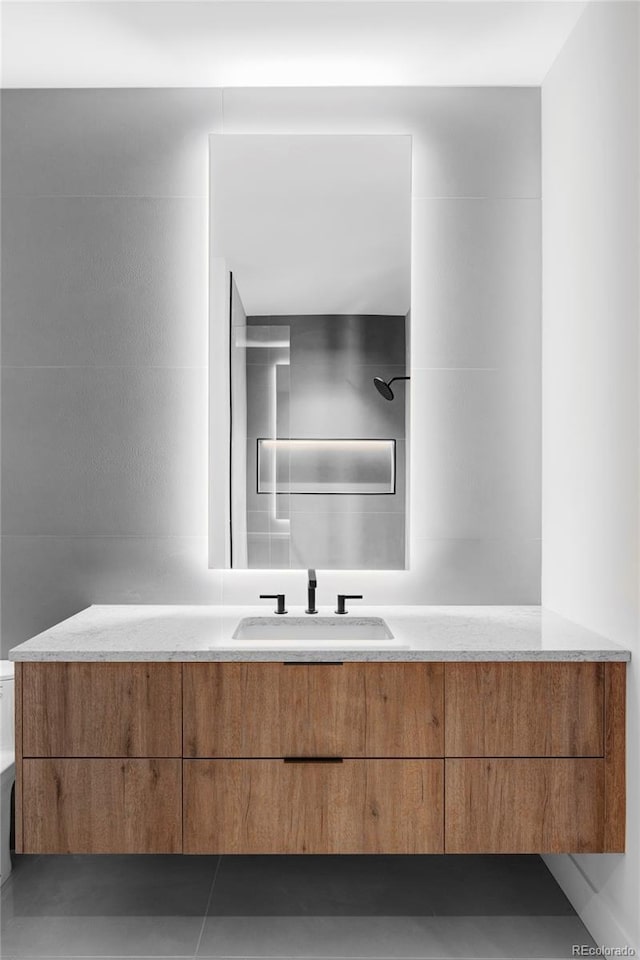 bathroom with vanity and walk in shower