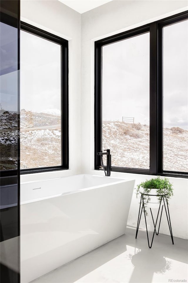 bathroom with a soaking tub