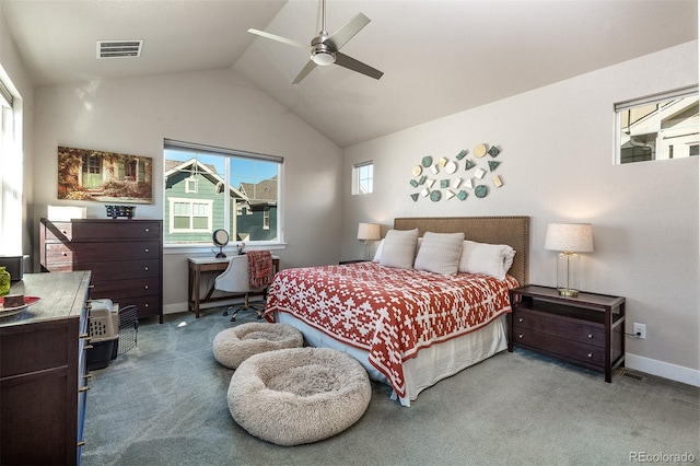 bedroom with ceiling fan, carpet floors, and vaulted ceiling