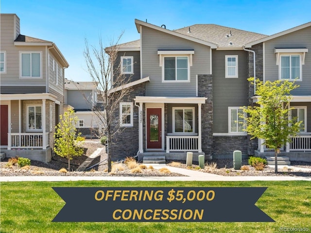 23527 E 5th Pl, Aurora, CO 80018 - view of front facade with stone siding and a porch