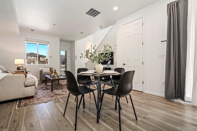 23527 E 5th Pl, Aurora, CO 80018 - dining space with light wood-style floors and recessed lighting