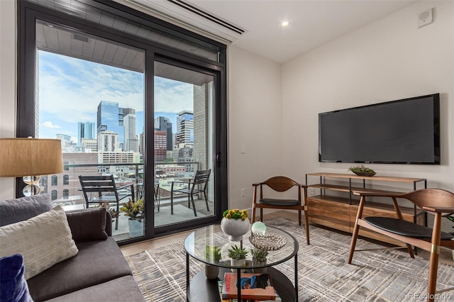 living room with expansive windows and recessed lighting