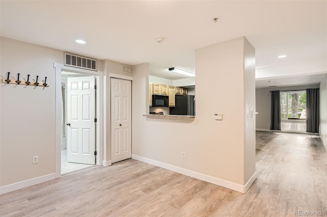 5201 S Fox St Unit 102, Littleton, CO 80120 - hallway featuring light wood-type flooring and recessed lighting