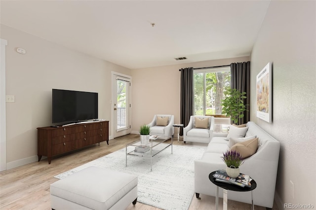 5201 S Fox St Unit 102, Littleton, CO 80120 - living area featuring plenty of natural light and light wood-style flooring