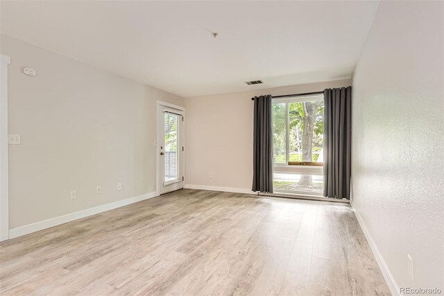 5201 S Fox St Unit 102, Littleton, CO 80120 - unfurnished room featuring light wood-type flooring and a pendent fire sprinkler