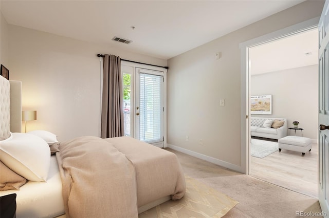 5201 S Fox St Unit 102, Littleton, CO 80120 - bedroom with access to outside and light carpet