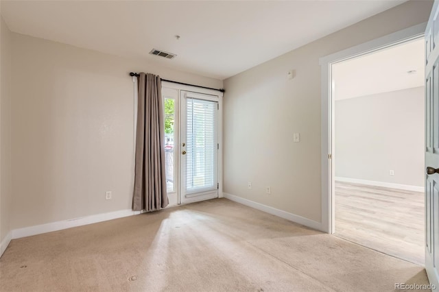 5201 S Fox St Unit 102, Littleton, CO 80120 - unfurnished room with baseboards and light colored carpet