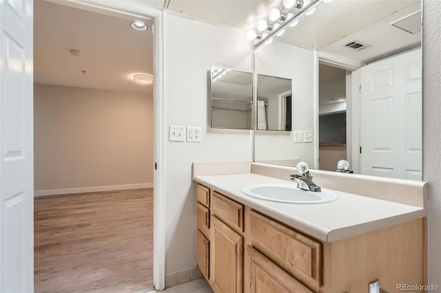 5201 S Fox St Unit 102, Littleton, CO 80120 - bathroom with vanity and wood finished floors