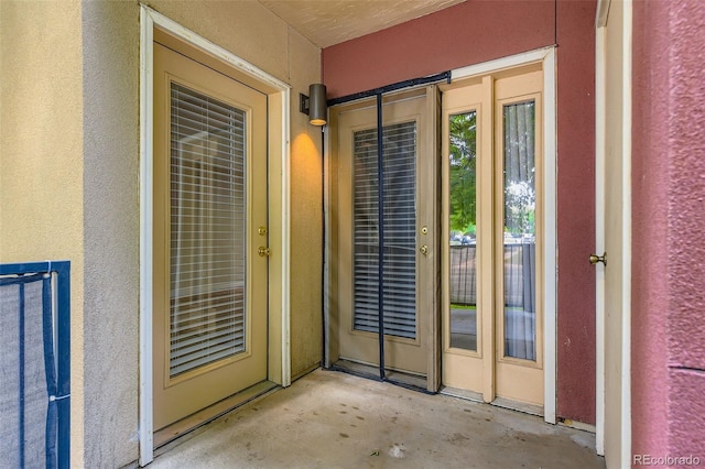 5201 S Fox St Unit 102, Littleton, CO 80120 - entrance to property featuring stucco siding and a patio
