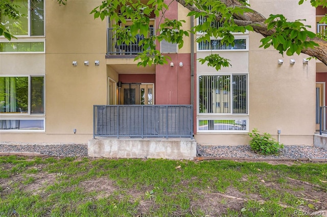 5201 S Fox St Unit 102, Littleton, CO 80120 - view of property exterior with stucco siding