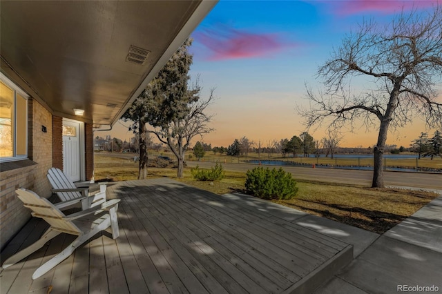 deck at dusk with a porch