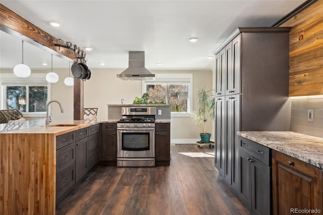 kitchen with dark wood-style flooring, a sink, stainless steel range with gas cooktop, light stone countertops, and island exhaust hood