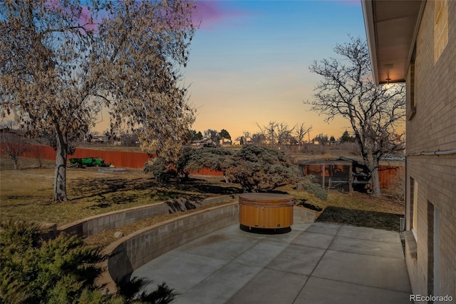 view of patio / terrace featuring fence