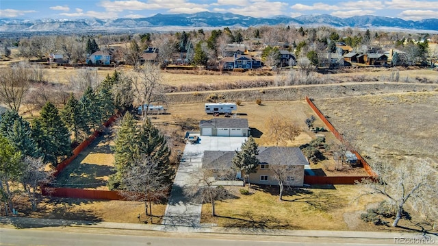 drone / aerial view with a residential view and a mountain view