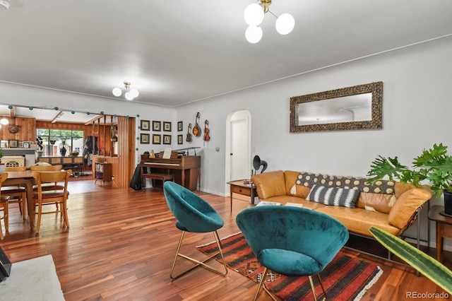 4040 Cody St, Wheat Ridge, CO 80033 - living room with arched walkways and wood finished floors