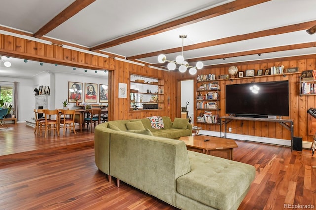 4040 Cody St, Wheat Ridge, CO 80033 - living room featuring wooden walls, beamed ceiling, wood finished floors, and a chandelier