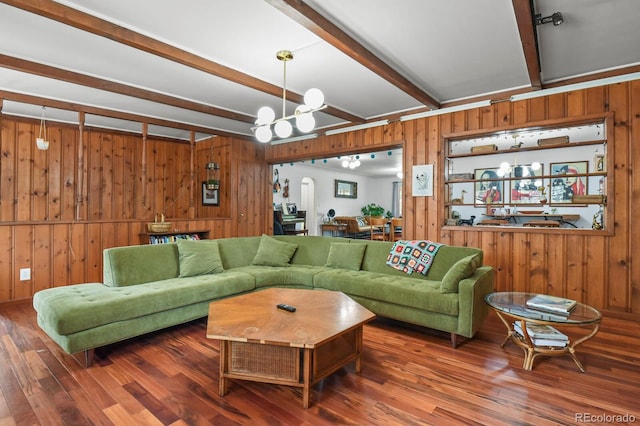 4040 Cody St, Wheat Ridge, CO 80033 - living room featuring beamed ceiling, wood walls, a chandelier, and wood finished floors