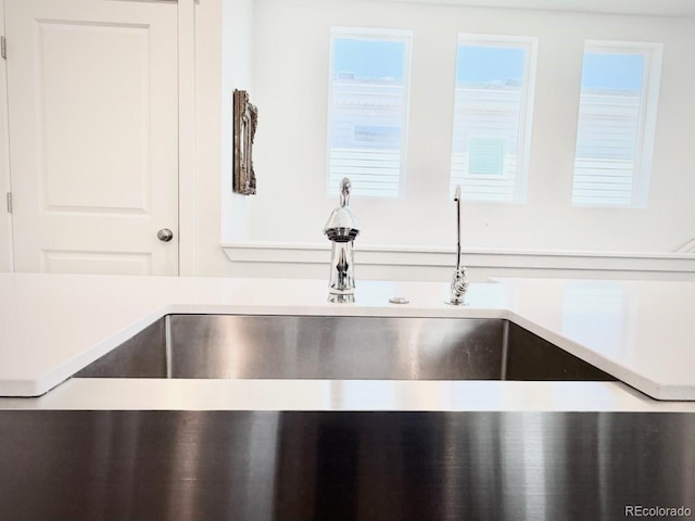 details featuring a sink and light countertops