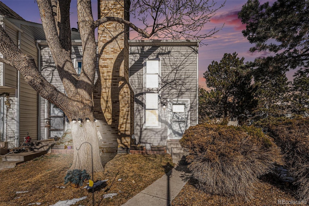 view of property exterior at dusk