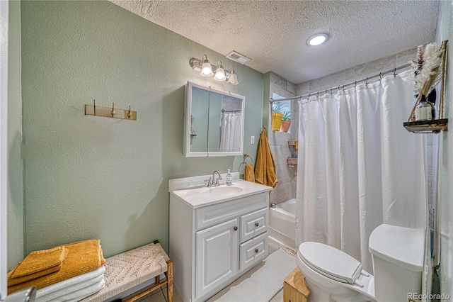 full bathroom with vanity, shower / tub combo, a textured ceiling, and toilet