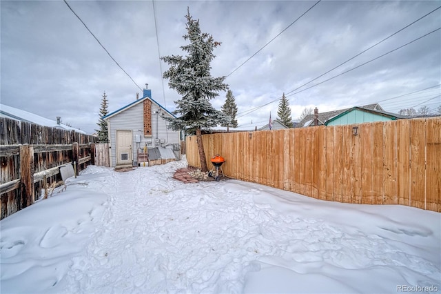 view of yard layered in snow