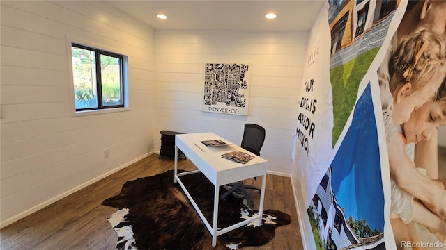 office area featuring hardwood / wood-style flooring and wood walls