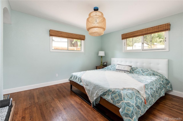 bedroom featuring dark wood-type flooring