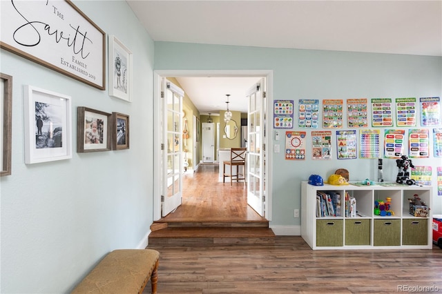 corridor featuring hardwood / wood-style flooring