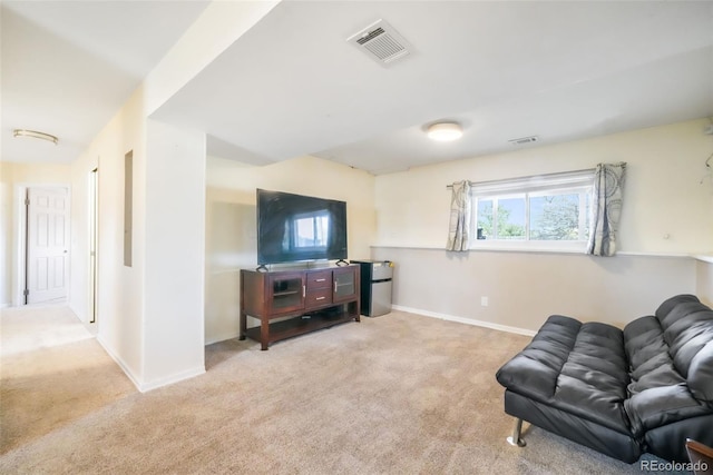 living room featuring carpet flooring and baseboards