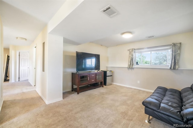 living area featuring carpet and baseboards