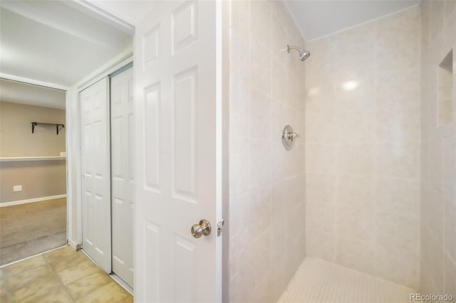 full bathroom with a tile shower