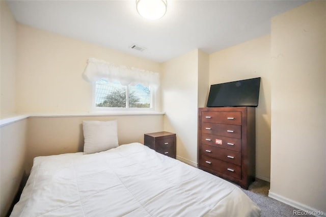 bedroom featuring carpet floors and baseboards
