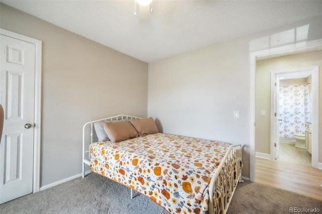 carpeted bedroom featuring baseboards and ceiling fan