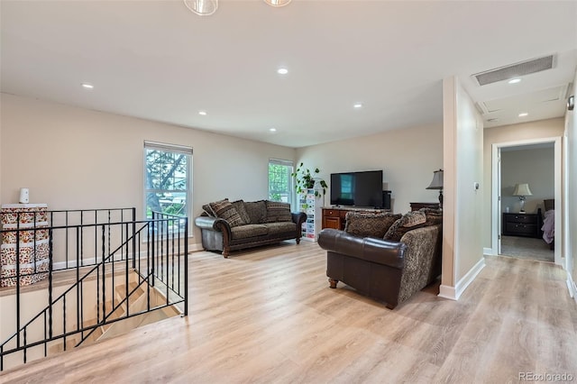 15691 E Atlantic Cir, Aurora, CO 80013 - living area featuring light wood-style flooring, recessed lighting, and baseboards