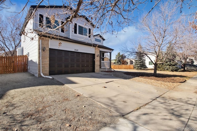 view of side of home featuring a garage