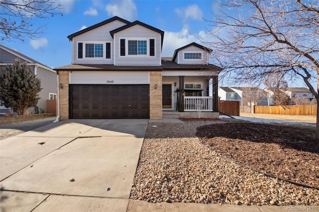 view of front of home with covered porch and a garage