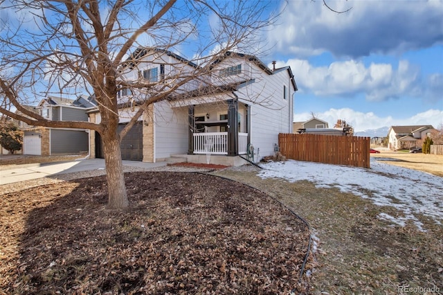 view of front of property with a porch and a garage