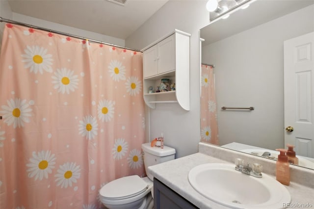 bathroom with vanity and toilet