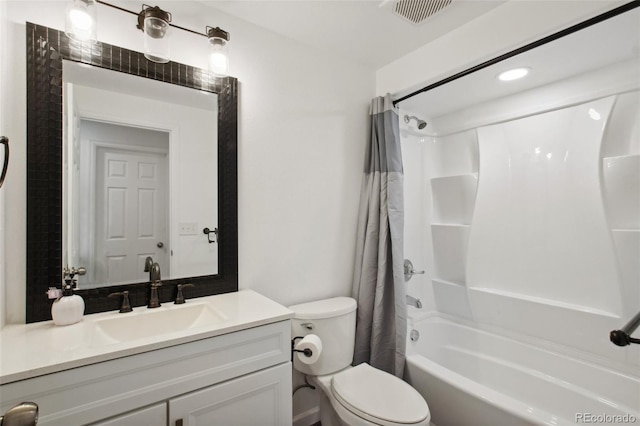 full bathroom with shower / bath combination with curtain, toilet, and vanity