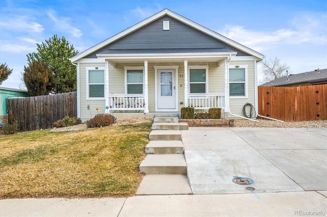 bungalow-style house with a front yard and a porch