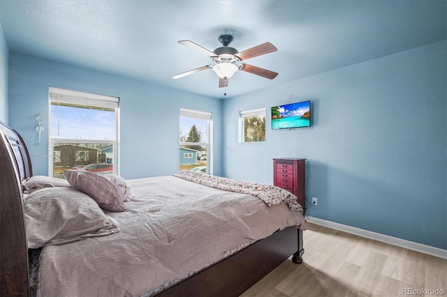 bedroom featuring ceiling fan and light wood-type flooring