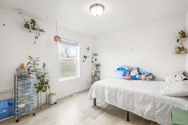 bedroom with light hardwood / wood-style flooring