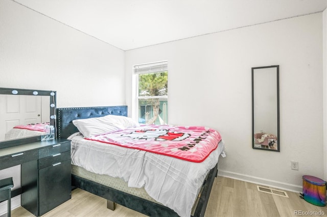 bedroom featuring light hardwood / wood-style floors