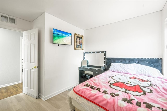 bedroom featuring hardwood / wood-style floors