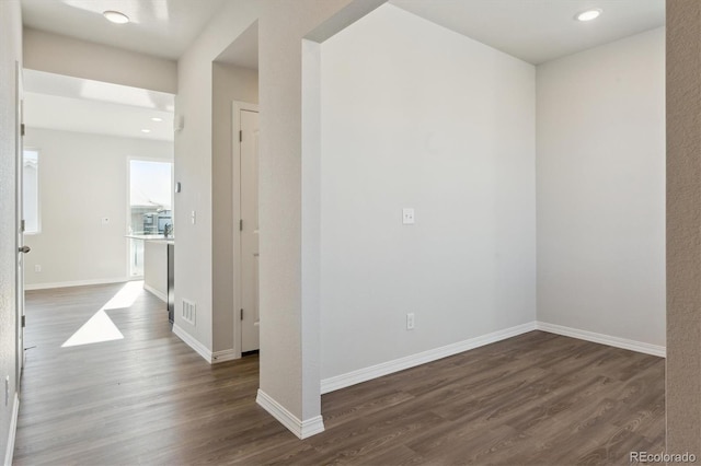 spare room featuring dark hardwood / wood-style floors