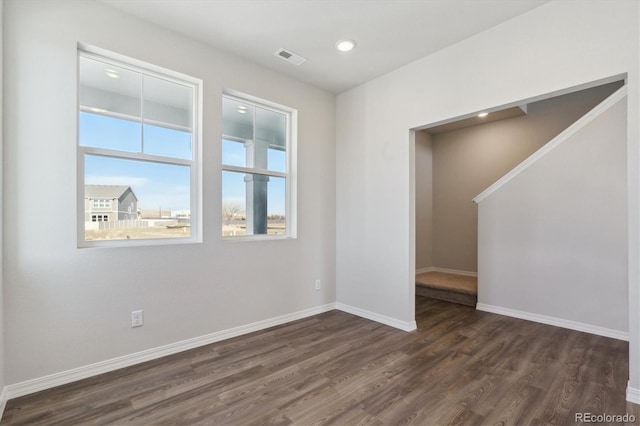 unfurnished room featuring dark hardwood / wood-style floors