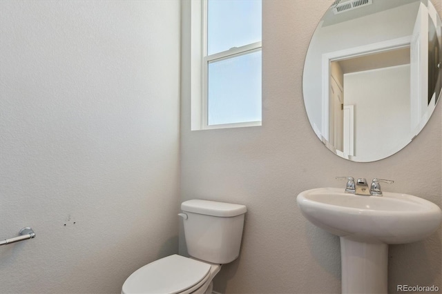 bathroom with sink and toilet