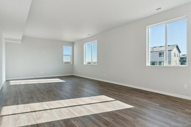 empty room featuring dark hardwood / wood-style floors